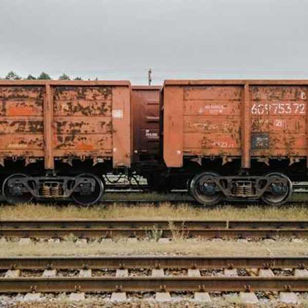 An old freight train on railroad tracks