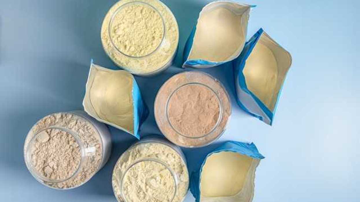 An overhead view of eight protein powder packages