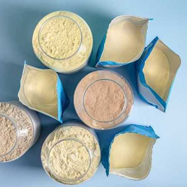 An overhead view of eight protein powder packages