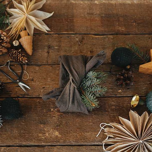 An overhead view of natural holiday wrapping and decorations