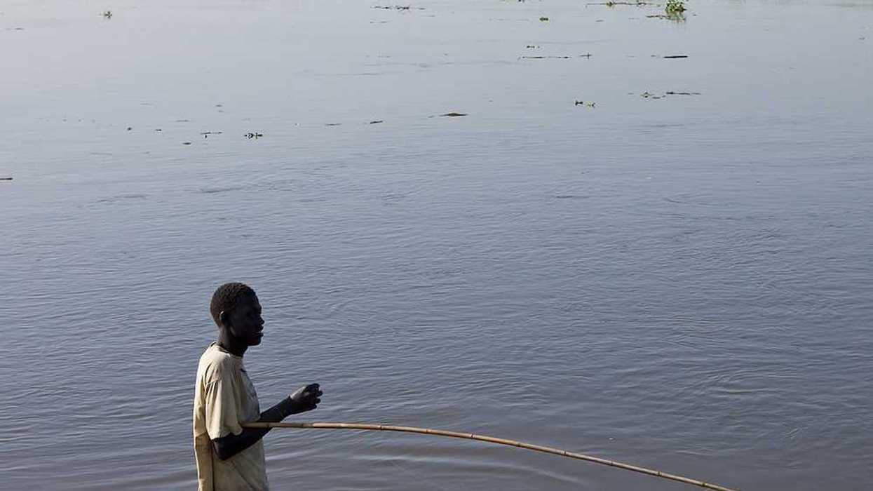 An unidentified man fishes in the White Nile river of South Sudan.