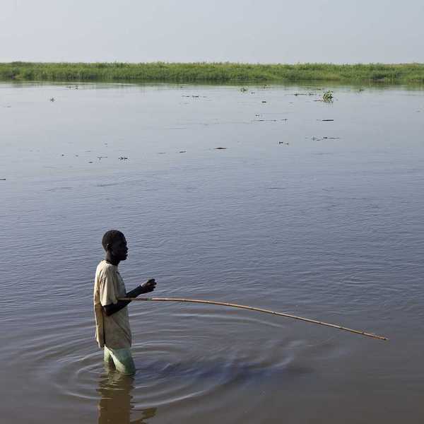 An unidentified man fishes in the White Nile river of South Sudan.