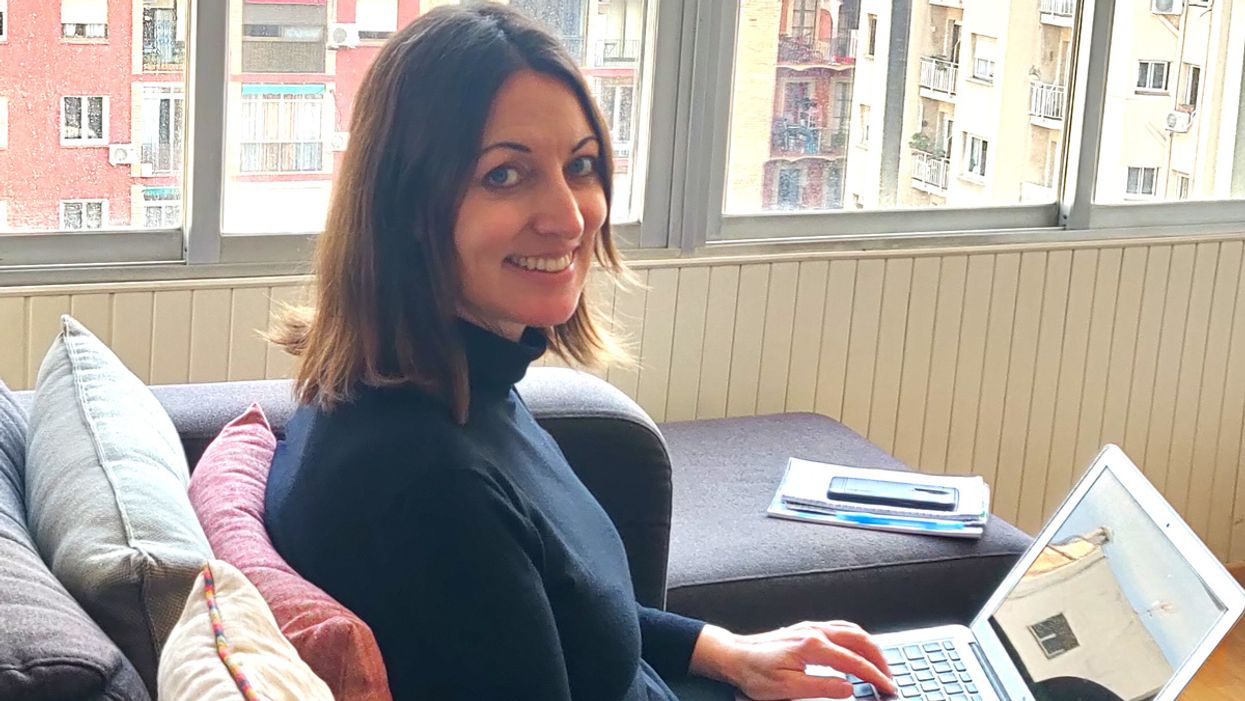 Autumn Spanne working by a window in Barcelona