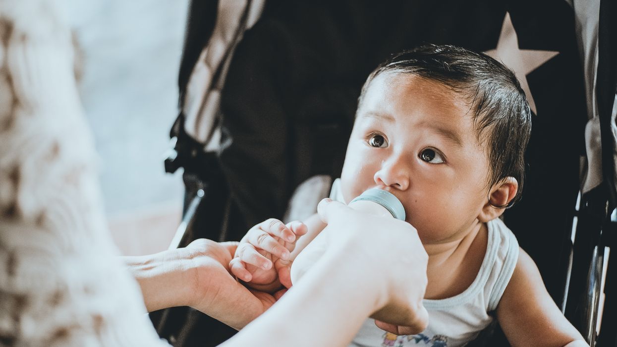 baby drinking from a bottle