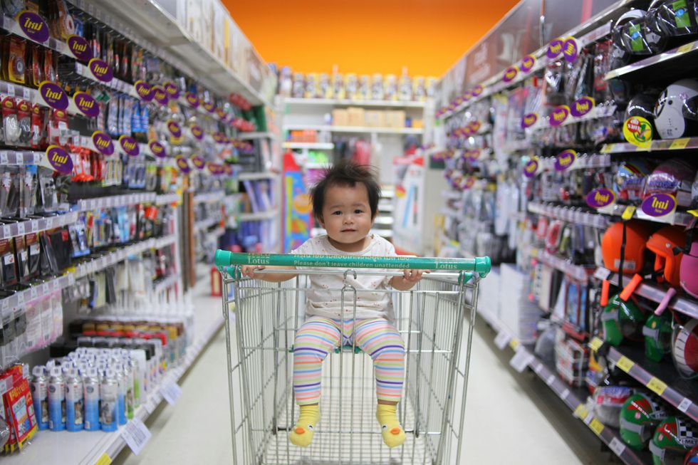 baby in shopping cart supermarket