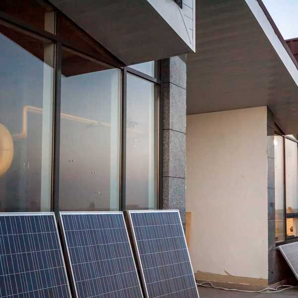 Balcony solar: solar panels on balcony of modern office building