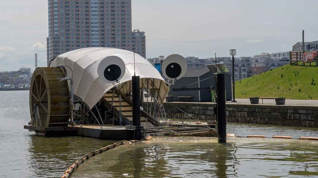 Baltimore's inner harbor water wheel scoops up debris in the harbor for eventual disposal.