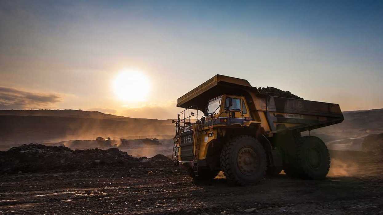 Big yellow mining truck at coal mine work site