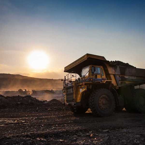 Big yellow mining truck at coal mine work site