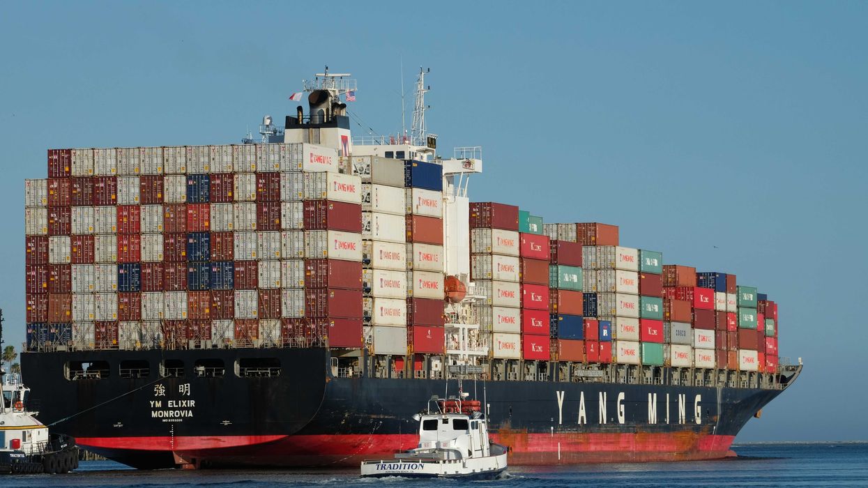 black and red ship on body of water at daytime.