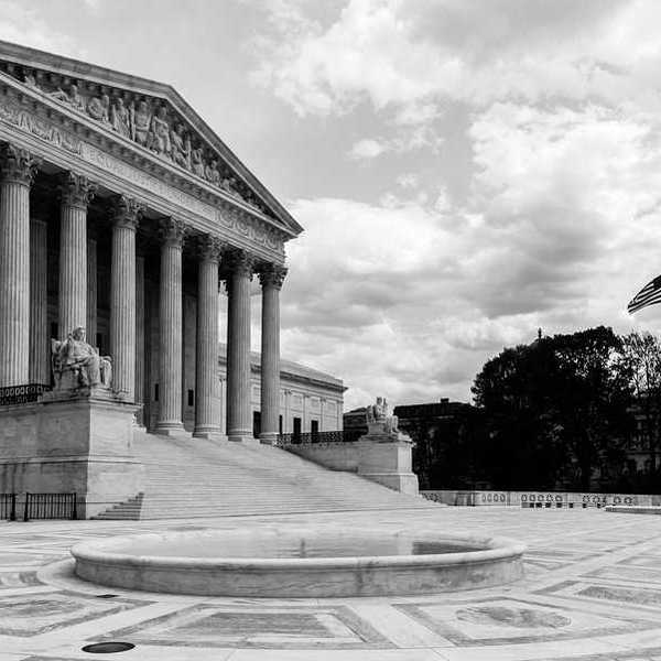 Black and white photo of the Supreme Court of the U.S.