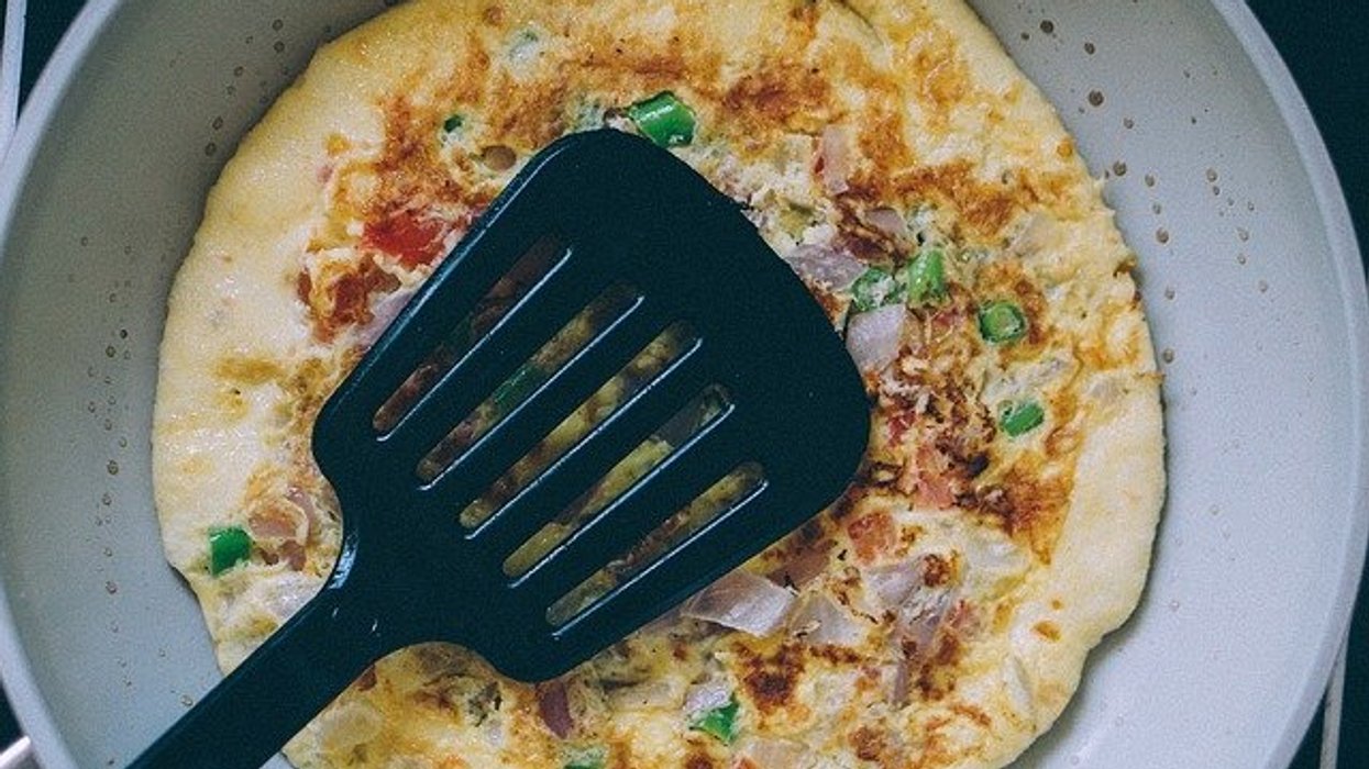 black plastic spatula on an omelet