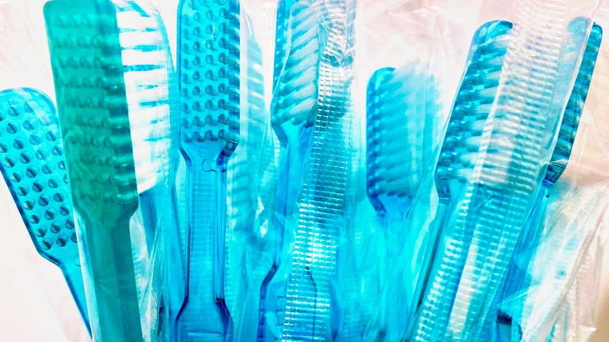 Blue plastic toothbrushes