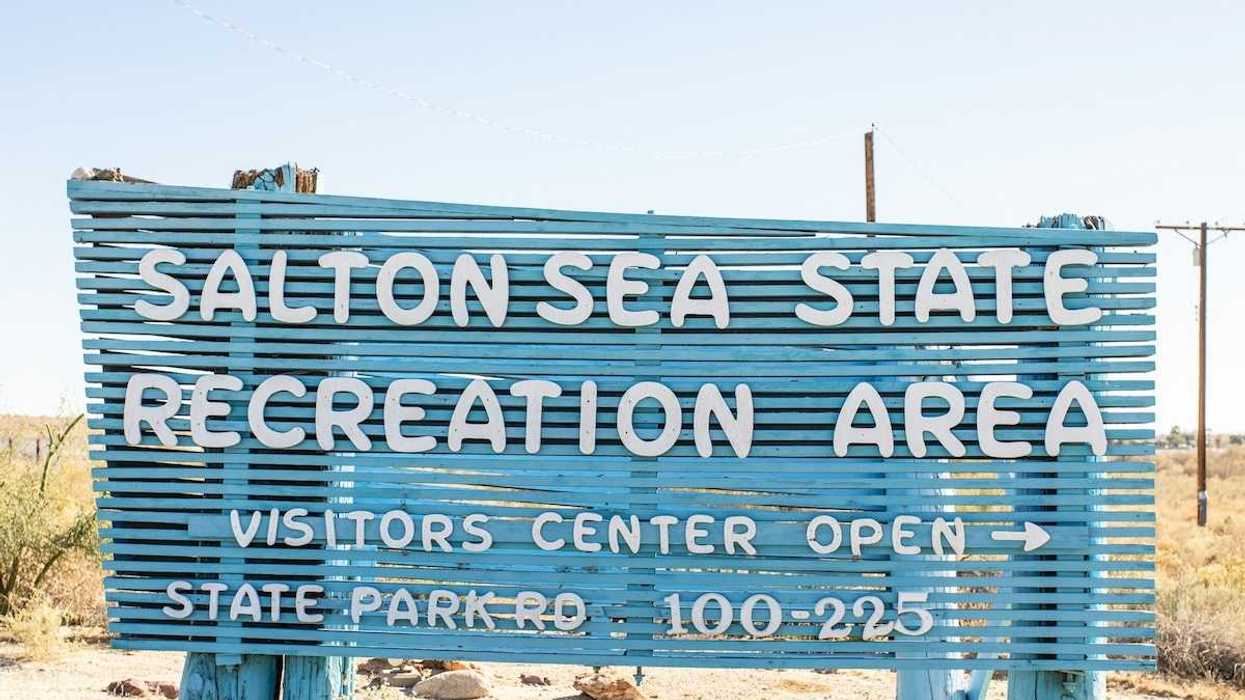 Blue sign with white letters announcing the entrance to Salton Sea Recreation Area