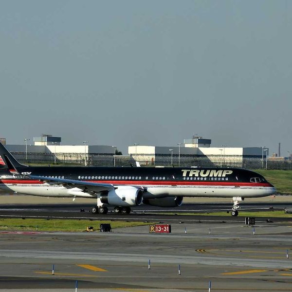 Boeing 757 jet airplane bearing the logo of Donald Trump takes off from Laguardia New York City