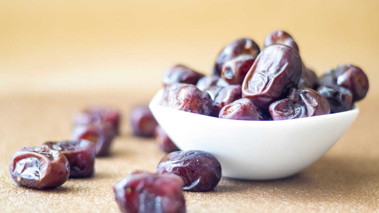 brown round fruit in white ceramic bowl