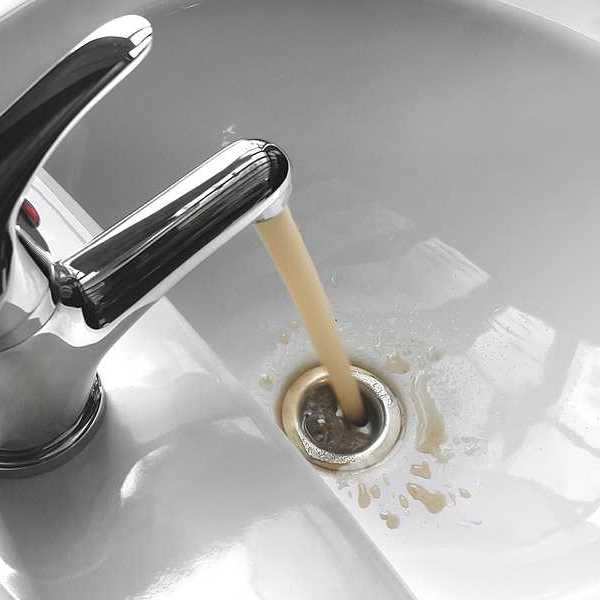 Brown water coming out of a bathroom faucet