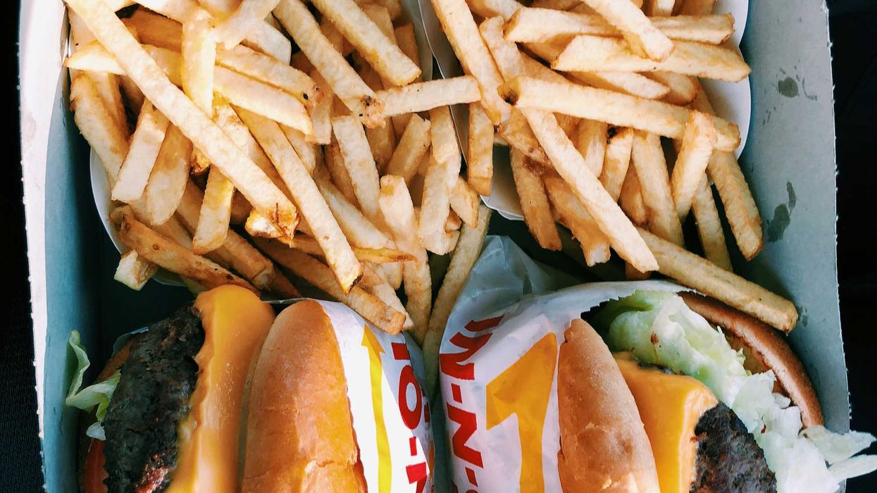 burgers and fries inside box.
