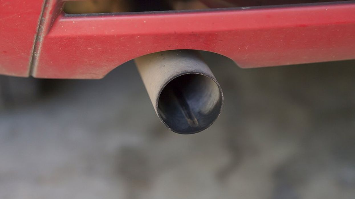 Car tailpipe up close.
