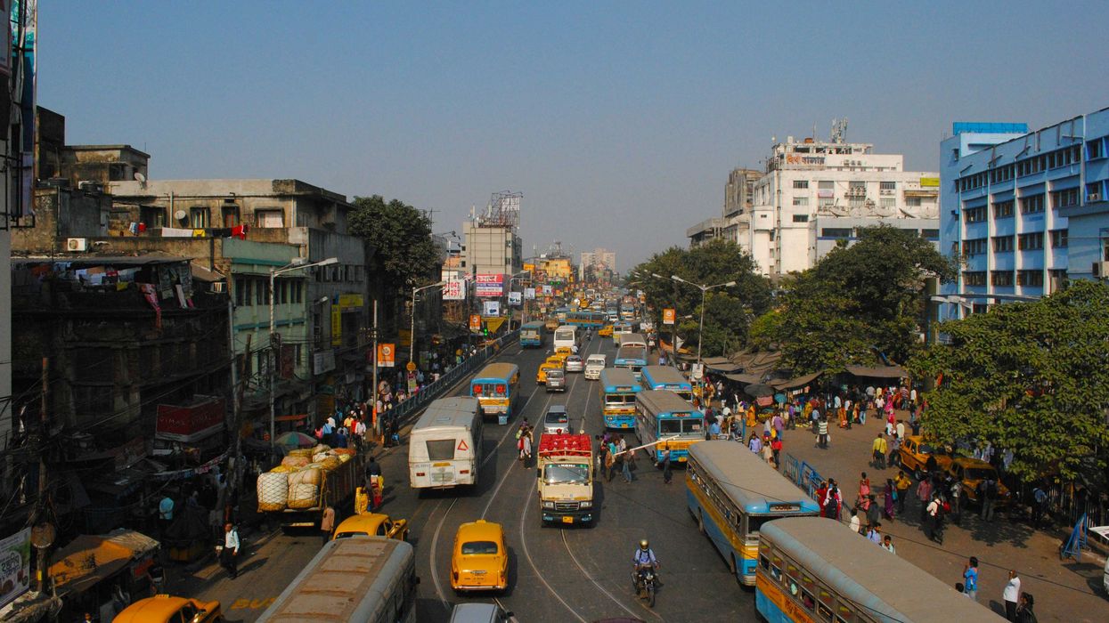 cars on road near buildings during daytime
