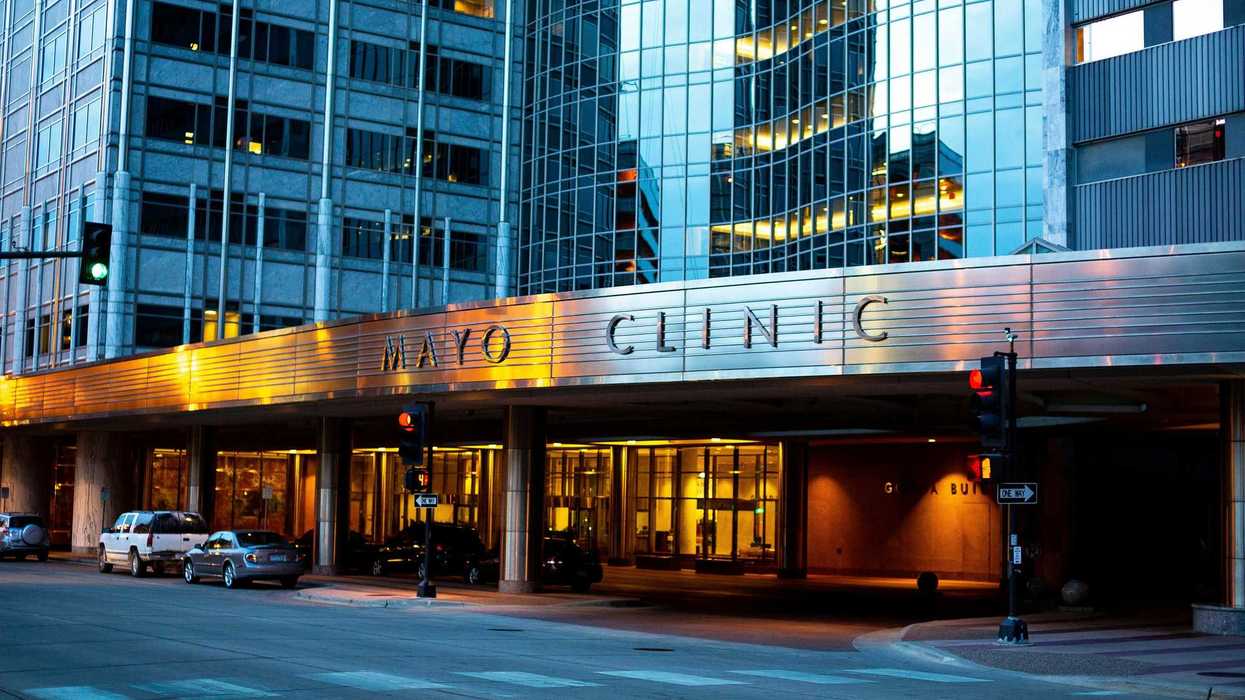 cars parked in front of building with the Mayo Clinic logo during daytime