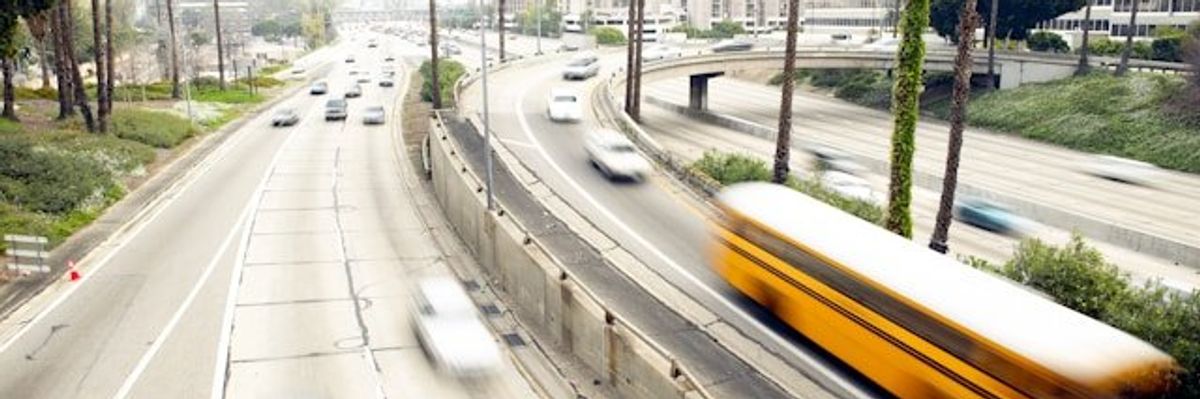 Cars speeding down a California highway.