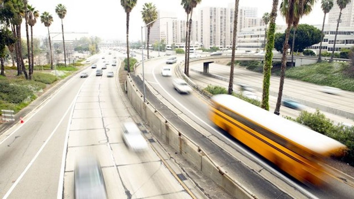 Cars speeding down a California highway.