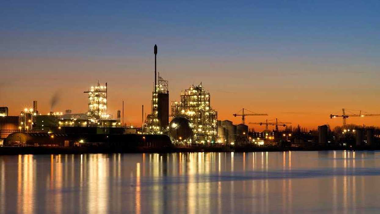 Chemours chemical facility on the banks of the river Merwede near Dordrecht at sunset (or sunrise)