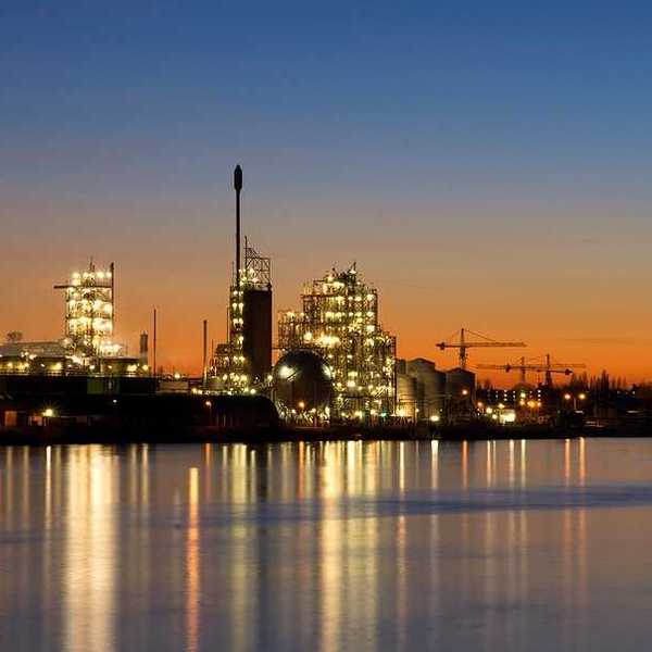 Chemours chemical facility on the banks of the river Merwede near Dordrecht at sunset (or sunrise)