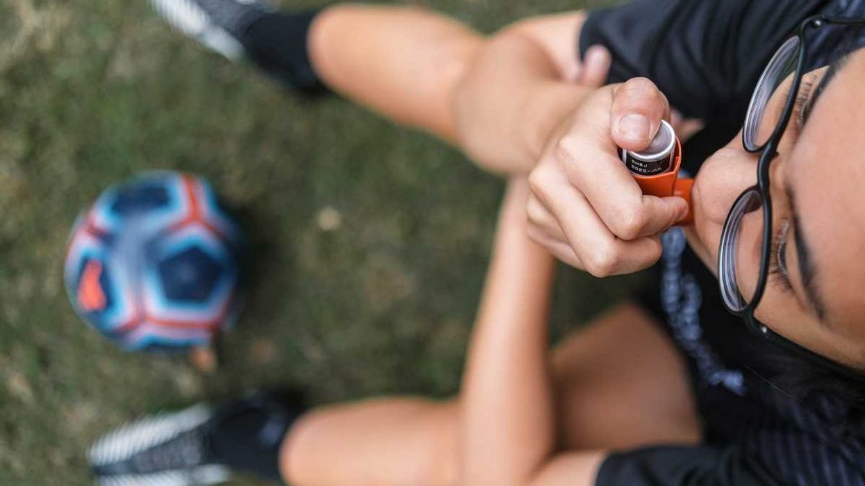 Child with asthma inhaler