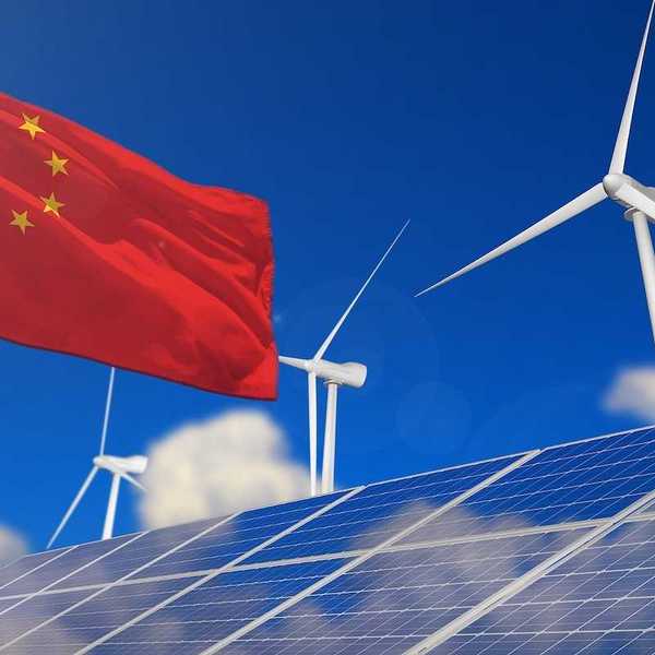 China renewable energy, wind and solar energy concept. Chinese flag superimposed with wind turbines and solar panels