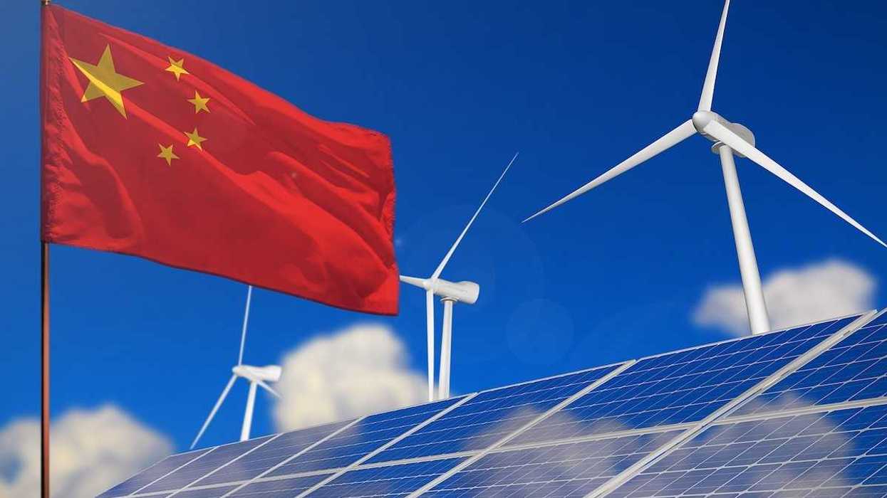 China renewable energy, wind and solar energy concept. Chinese flag with wind turbines and solar panels.