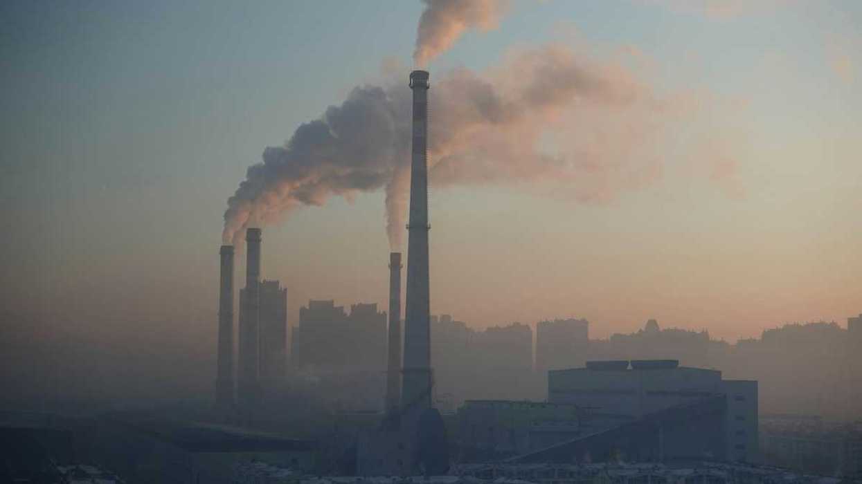 Chinese coal-fired power plant emitting pollution from four stacks