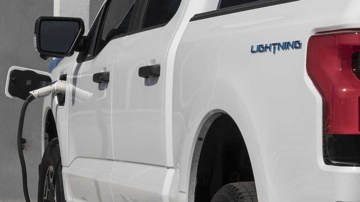 Circa September 2022: Ford F150 Lightning all-electric truck connected to EV charger