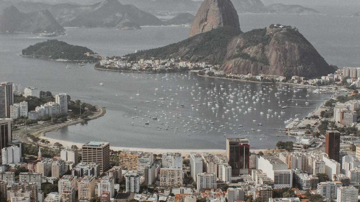 city buildings near body of water during daytime.