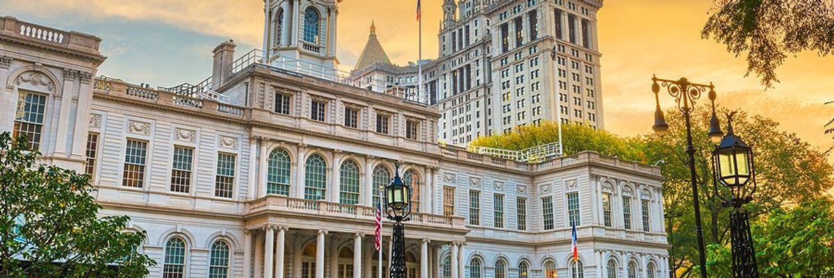 City Hall building in the city of New York with trees on periphery.