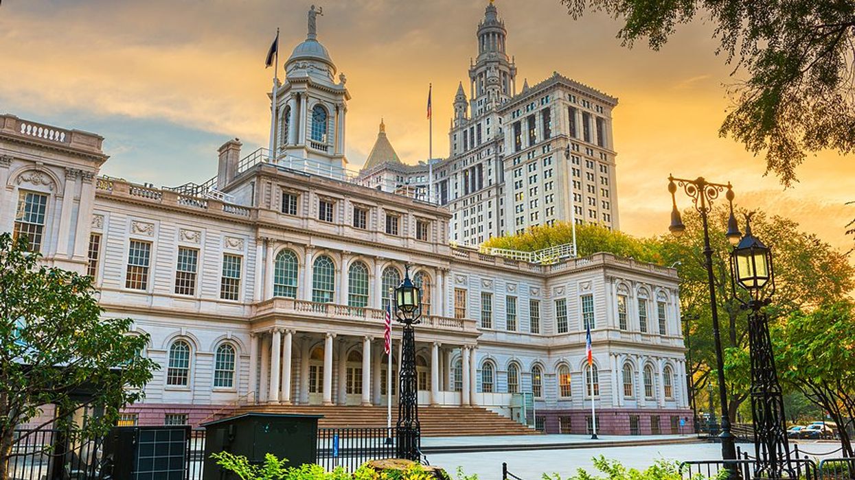 City Hall building in the city of New York with trees on periphery.