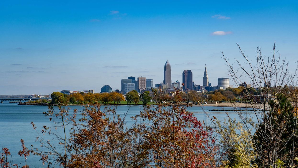 city skyline across body of water during daytime
