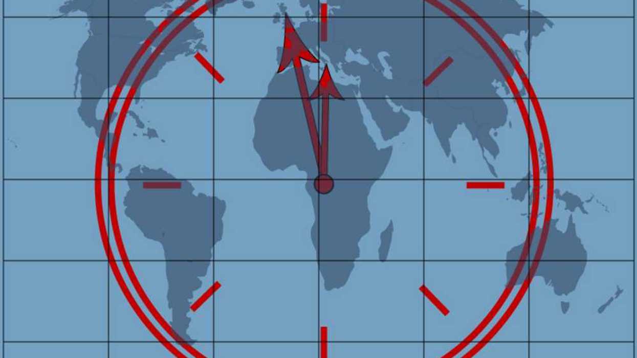 Clock approaching midnight superimposed over a world map