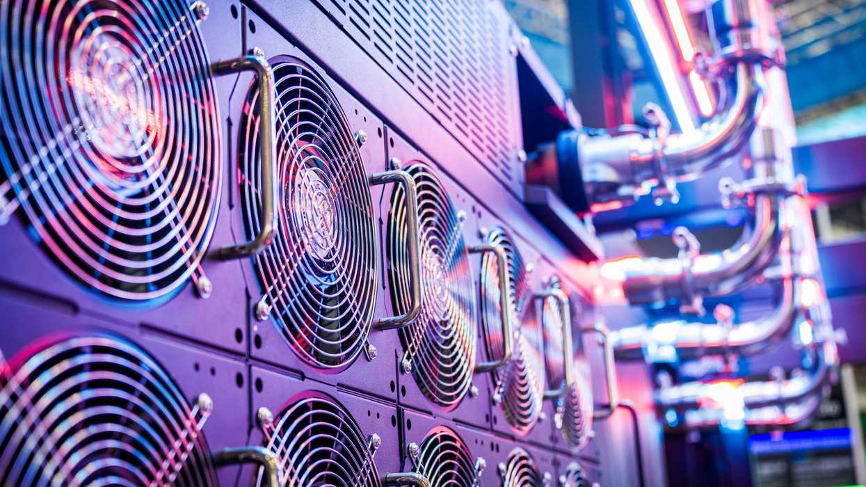 Close-up of server cooling fans in a vibrant data center.