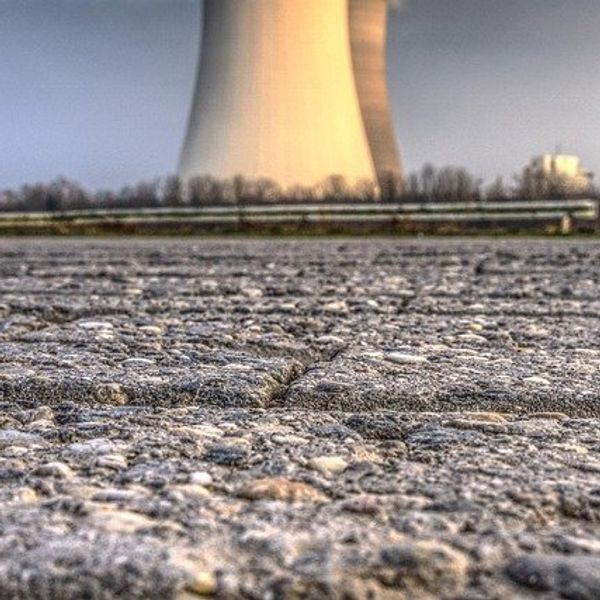 Closeup of pavement in front of nuclear facility.