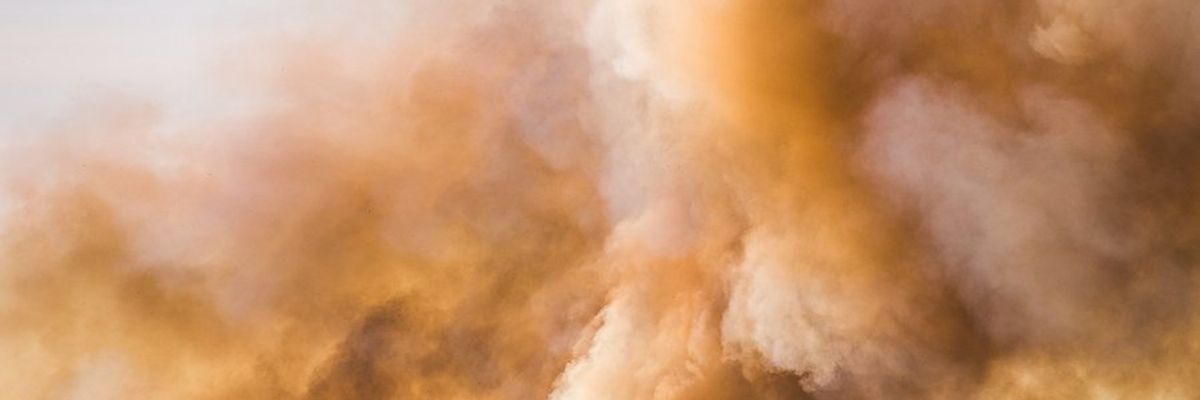 Clouds and smoke billowing into the sky.