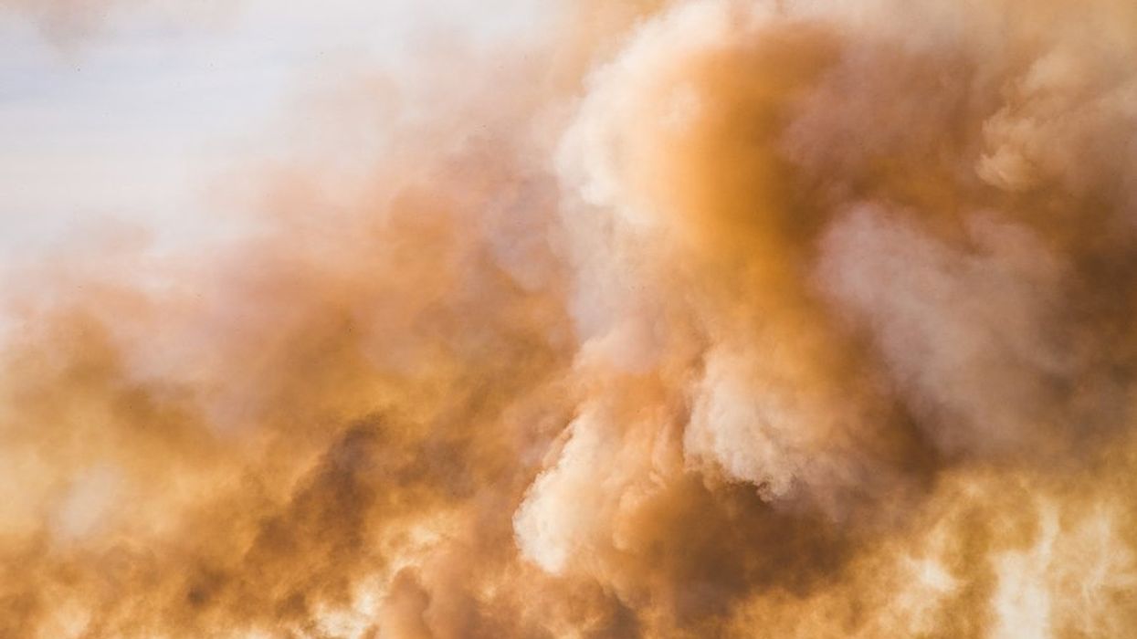 Clouds and smoke billowing into the sky.