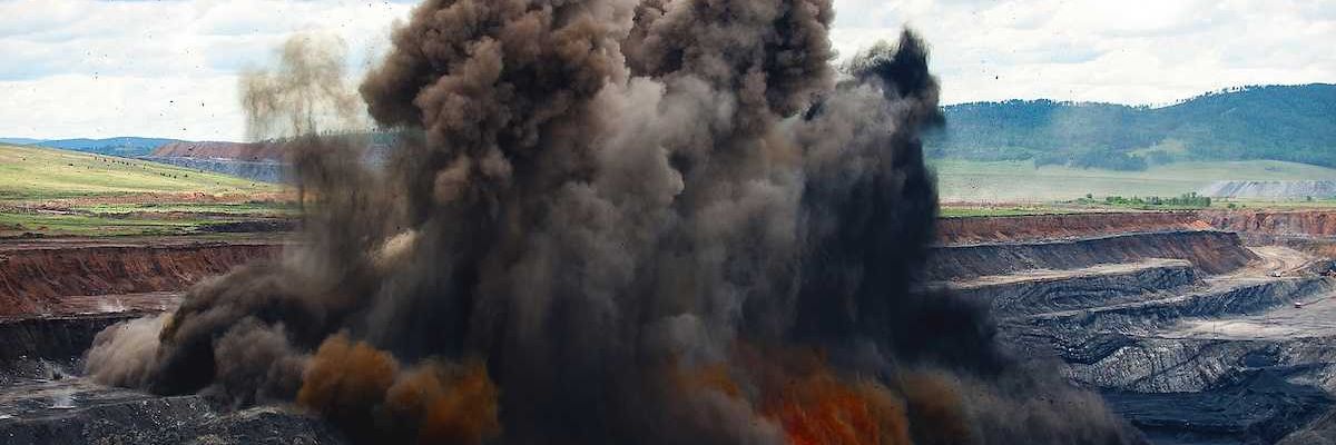 Coal mine blasting to remove overburden - explosion with dust cloud