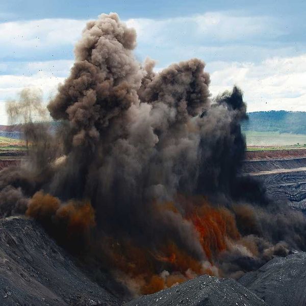 Coal mine blasting to remove overburden - explosion with dust cloud
