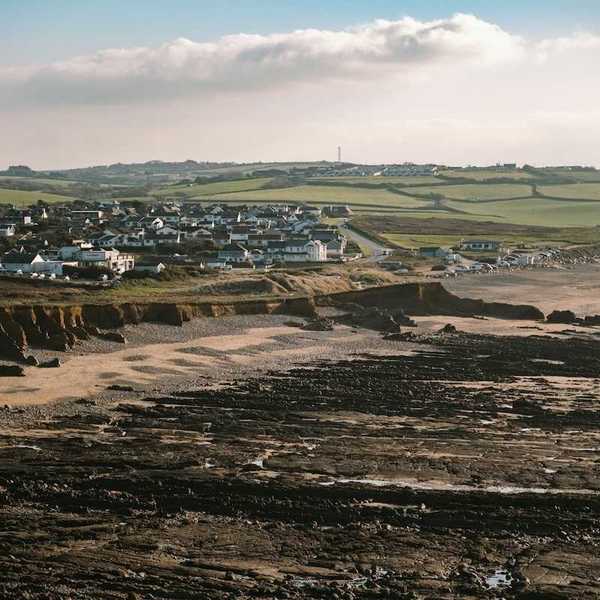 Coastal erosion threatening coastal UK like here at Widemouth Bay, Bude, UK