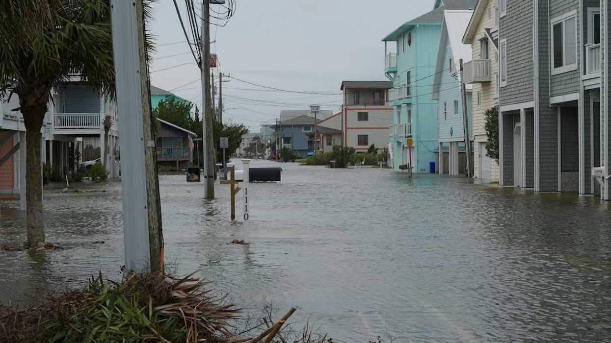 Coastal street flooding on Carolina Beach, NC during king tide.