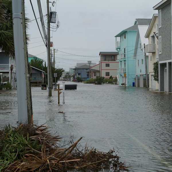 Coastal street flooding on Carolina Beach, NC during king tide.