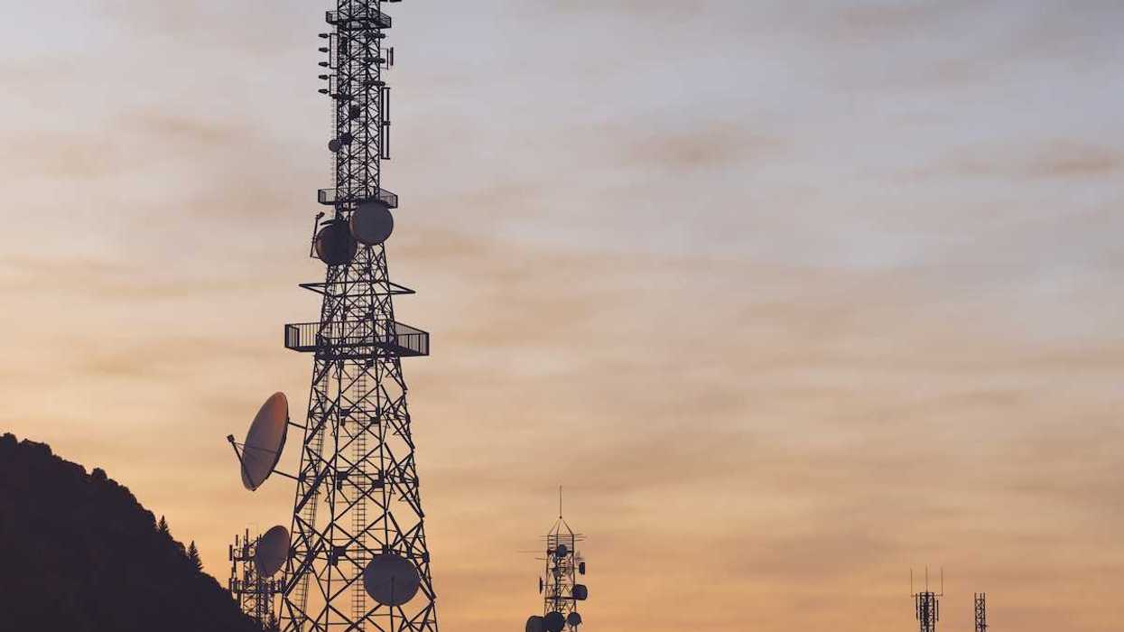 Communications towers on ridgetop sporting an array of communications and microwave antennas