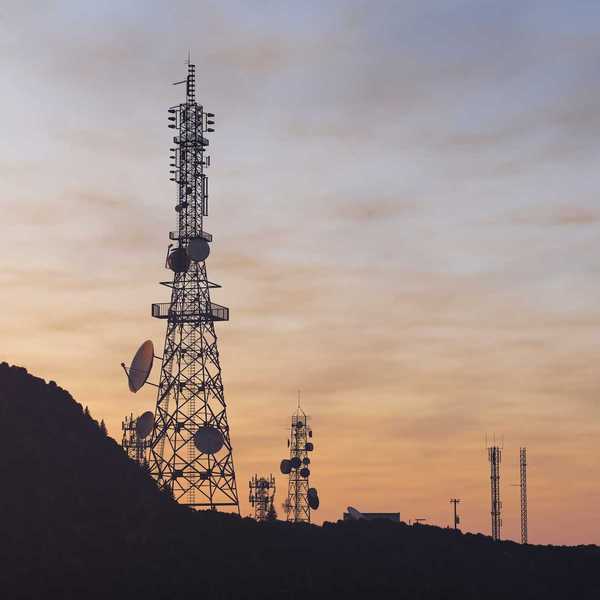 Communications towers on ridgetop sporting an array of communications and microwave antennas